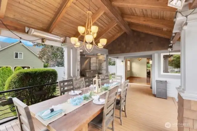 Outdoor dining area with built in BBQ. Looking at back entry to house.
