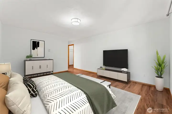 Spacious primary bedroom with private bath and walk-in closet.