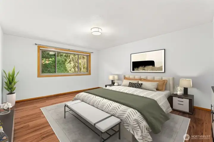 Spacious primary bedroom with private bath and walk-in closet.