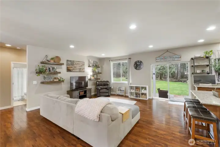 Light and bright family room with laminate flooring.