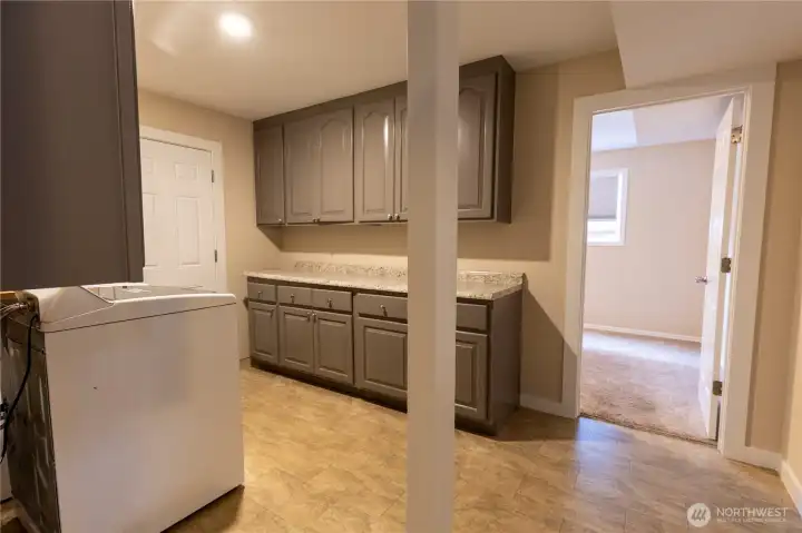 Laundry room and entry to downstairs bedroom (5th bedroom).