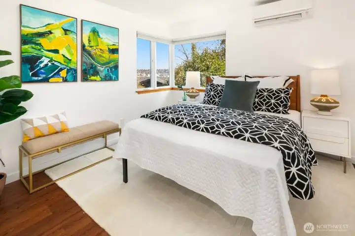 The first of three bedrooms on the mail floor, the primary sits at the end of the hall and has territorial views out the corner windows.