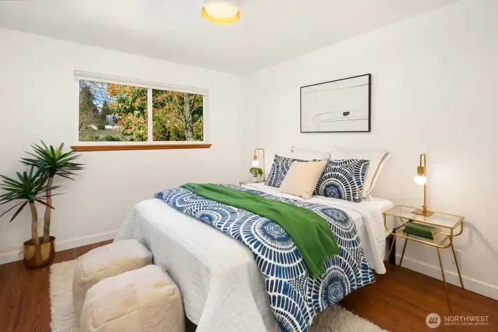 The second of two bedrooms is also located at the end of the hallway.