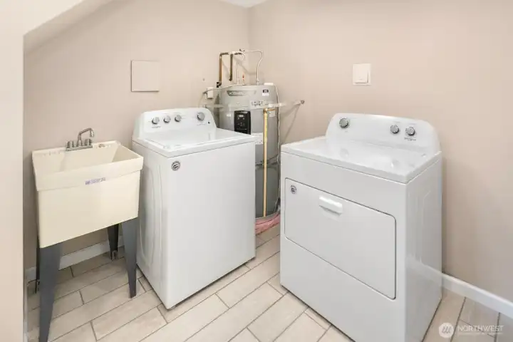 This large laundry room allows for even more storage.