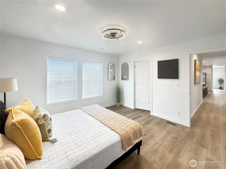 Primary bedroom toward walk in closet and door