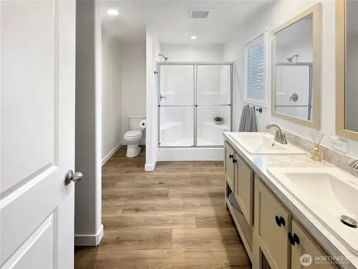 Primary bath with dual vanities and walk in shower