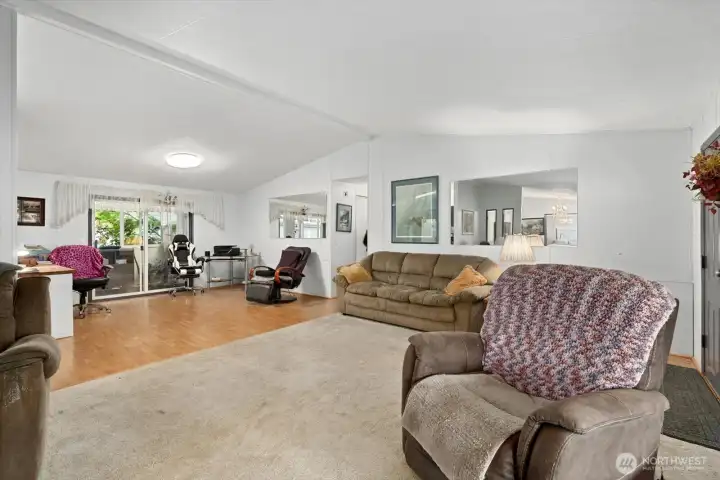 Living room open to family room and sun porch