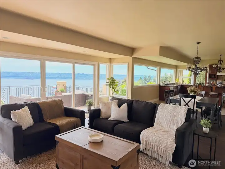 Open-concept living area connects effortlessly to the kitchen and expansive deck, offering the perfect setting for entertaining or simply soaking in the views