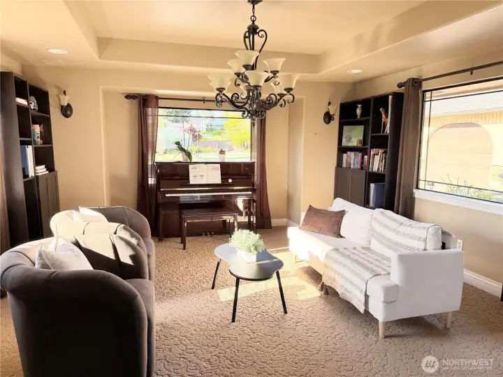Formal dining room currently styled as a cozy upstairs living space—perfect for reading, relaxing, or creating your ideal retreat.