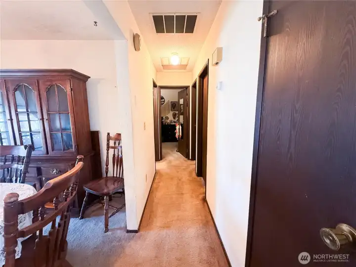 Hallway to the bedrooms & shared full bath