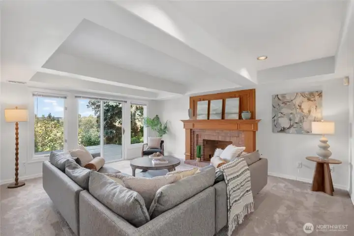 Rec room with box ceiling and custom fireplace with access to lower deck Rec room with box ceiling and custom fireplace with access to lower deck