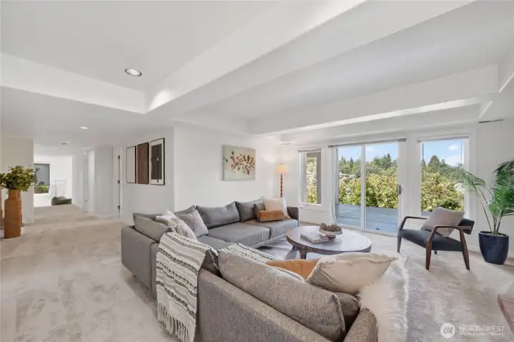 Rec room with box ceiling and custom fireplace with access to lower deck Rec room with box ceiling and custom fireplace with access to lower deck