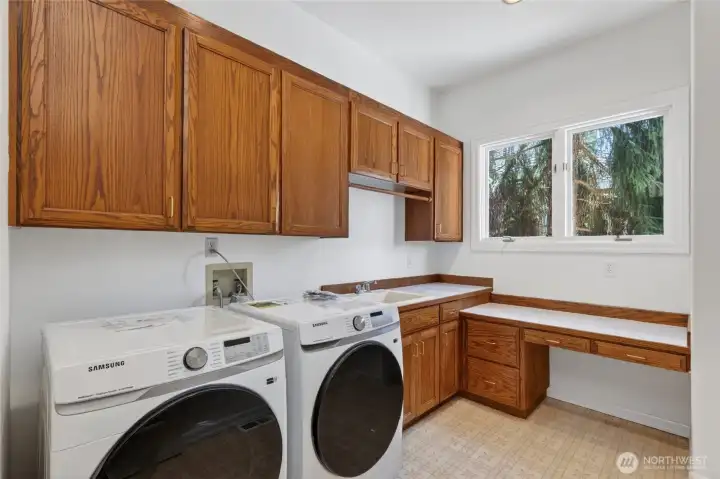 Spacious laundry room with brand-new washer/dryer and utility sink Spacious laundry room with brand-new washer/dryer and utility sink