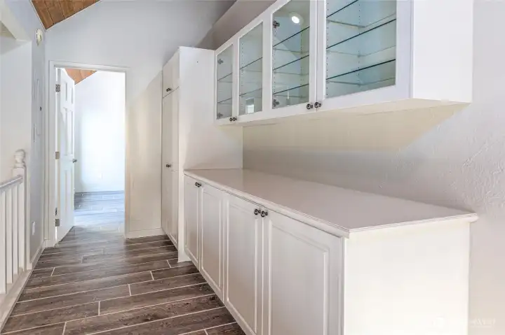 Whether envisioned as a coffee bar, library, art display, home office, or planning center, this unique space provides exceptional storage rarely found in condominium living. Whether envisioned as a coffee bar, library, art display, home office, or planning center, this unique space provides exceptional storage rarely found in condominium living.