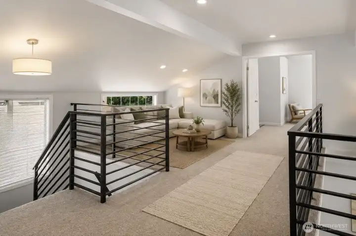 Virtually staged photo of the loft upstairs!