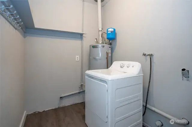 The lower level utility room is situated within the flex space.