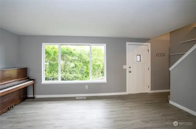 Enter into the living area with brand-new LPV flooring spanning the entire home.