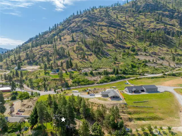 Annotated aerial view looking back towards hillside.