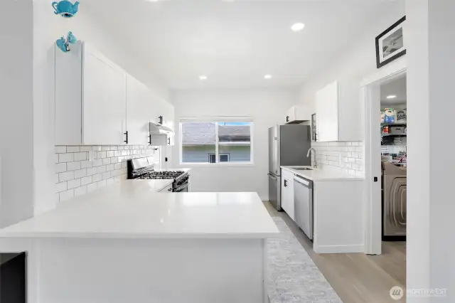 From living area with one- this kitchen fresh and bright ready for your personal touch.