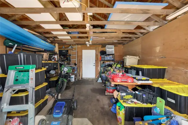 Outbuilding with additional storage and can potentially be converted to a garage.