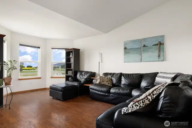 Living room with vaulted ceiling.