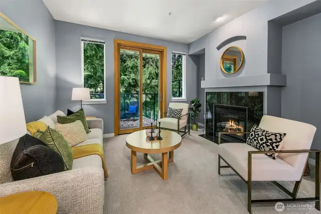 Lovely living room with outlooks of trees; very peaceful.
