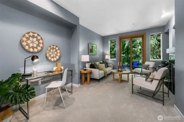 Lovely living room with outlooks of trees; very peaceful.