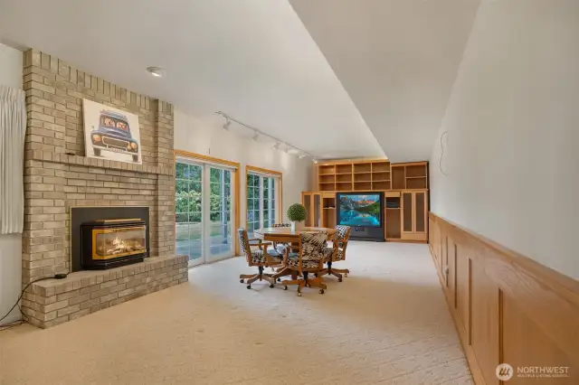 This massive lower-level game room is the ultimate flex space—perfect as a media hub, rec room, or potential in-law suite or teen retreat. A wall of built-in cabinetry offers storage for games, gear, or an entertainment system