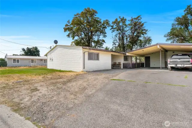 There is plenty of gravel parking and a carport for one car.