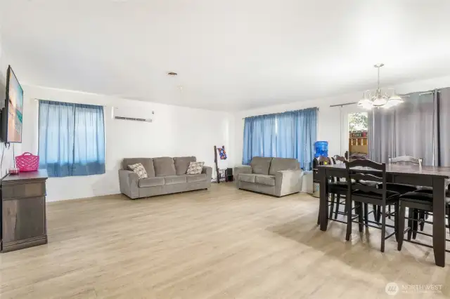 Newer vinyl planking run from the living and dining area down the hallway into other rooms. Easy to clean and convenient!