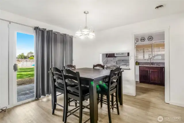 The dining area supports room for six to eat at the table.