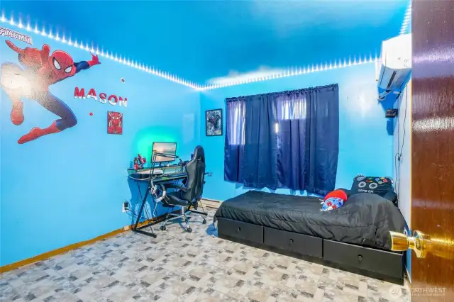 Well lit and spacious, this second bedroom is perfect for a bedroom, office, or craft room. It faces the backyard.