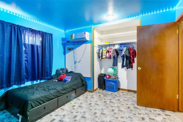 Notice the mini-split for heating and cooling, as well as an older style, working air conditioner in the window.