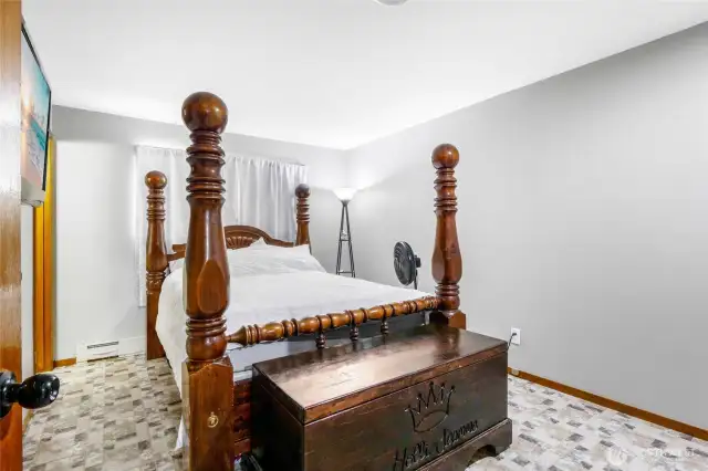 The primary bedroom is in the front corner of the front of the house and has a half bath to the left of the head of the bed.