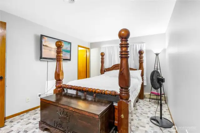The primary bedroom is enhanced with TV capabilities and also enjoys the hard flooring of vinyl.