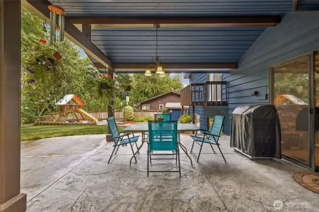This will be a favorite! Covered patio with stamped concrete!