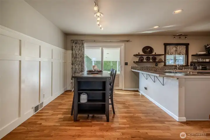Dining area open to kitchen, slider to covered back patio