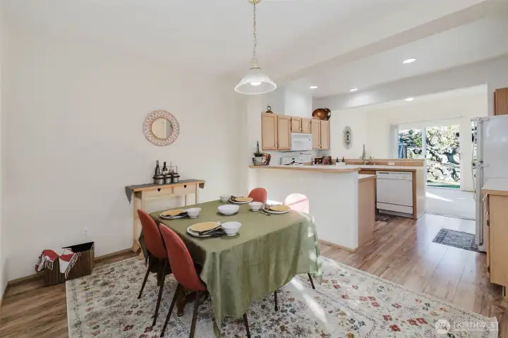 Dining room and kitchen have LVP flooring.
