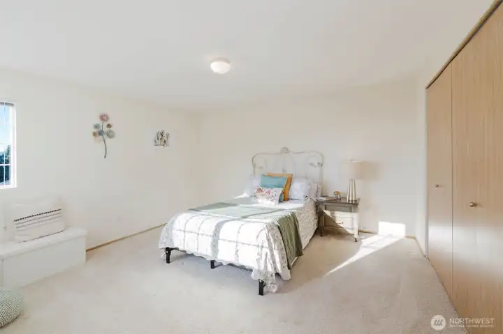 Primary bedroom with peek a boo views of the Olympic mountains.