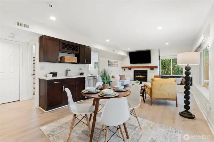 Spacious lower level with kitchenette, living area, and fireplace ideal for guests or multi-generational living