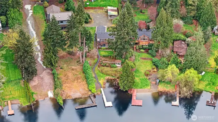 Aerial view of Echo Lake waterfront property showcasing private setting, mature landscaping, and direct water access