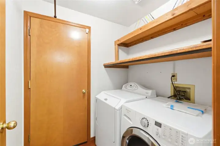 Laundry room w/ storage shevels
