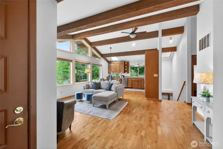 These gorgeous beams anchor the main level living, complete with hardwood floors.