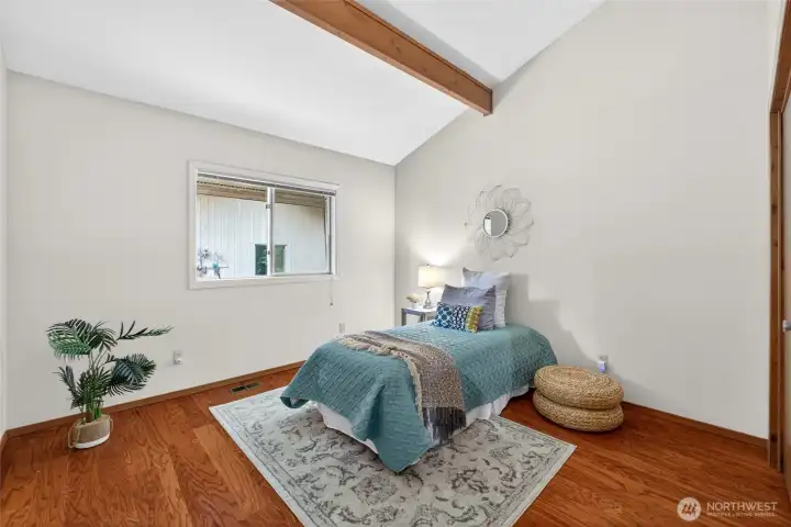 The secondary bedroom has vaulted ceilings as well, and plenty of space for all of your furnishings.