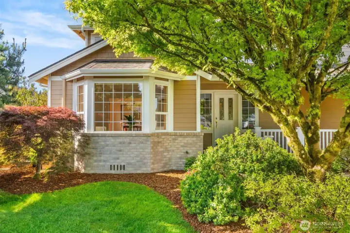 Welcoming entry with mature landscaping framing the views. Welcoming entry with mature landscaping framing the views.