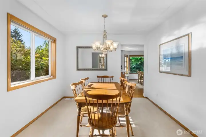 Spacious dining room with a large window for light is open to living room. Plenty of wall space for your furnishings and room to entertain a crowd. Spacious dining room with a large window for light is open to living room. Plenty of wall space for your furnishings and room to entertain a crowd.