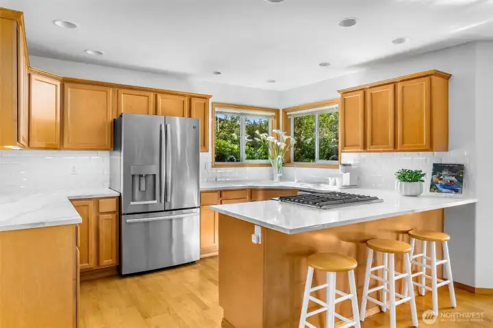 There is plenty of work and storage space here! Eating bar is a great spot for friends to gather while cooking, or a great homework spot. Handsome maple cabinetry. There is plenty of work and storage space here! Eating bar is a great spot for friends to gather while cooking, or a great homework spot. Handsome maple cabinetry.