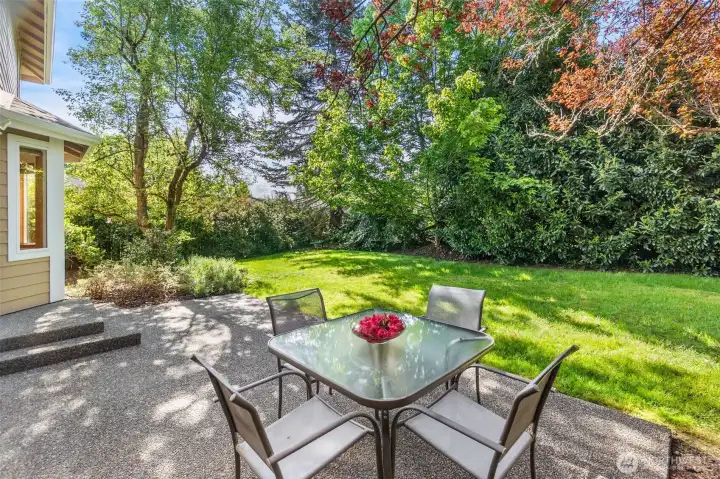 The spacious rear patio is the perfect spot for an al fresco meal. Privacy here that is unexpected right in town! The spacious rear patio is the perfect spot for an al fresco meal. Privacy here that is unexpected right in town!