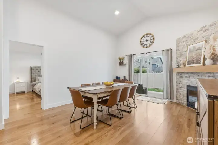 Great Room w/ Dining Space, Vaulted Ceilings & Access to the Outdoor Covered Patio
