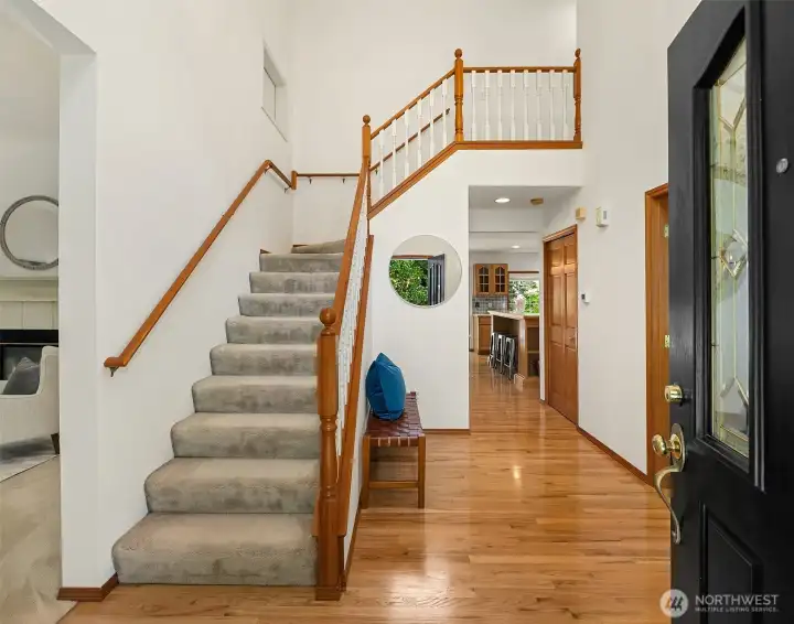 The dramatic entry with it's towering ceiling, ushers you into this beautiful home. The dramatic entry with it's towering ceiling, ushers you into this beautiful home.